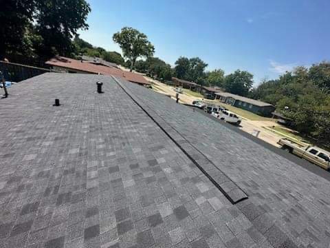 Professional roof repair work on residential home in Arlington Texas
